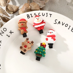 Detailed view of 5-piece Christmas hair clips featuring Santa, reindeer, and snowman icons