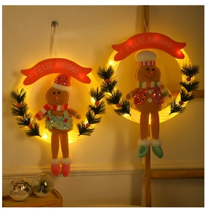 Illuminated Christmas gingerbread man wreath with LED lights and pine cone detail