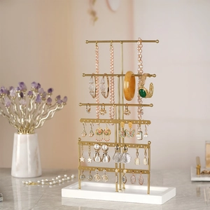 6-tier gold metal jewelry organizer with white base for necklaces and earrings