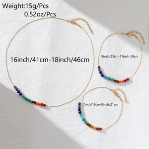 Detail of 14K gold plated chakra jewelry set with colorful natural stone beads