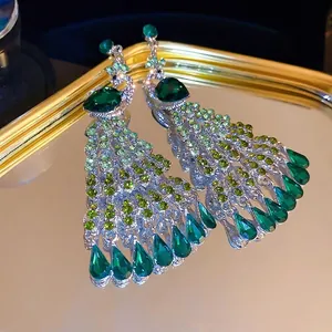 Elegant silver peacock tassel earrings with green crystals and rhinestones for women
