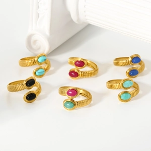 Detailed view of 18k gold plated stainless steel rings with colorful inlaid natural stones