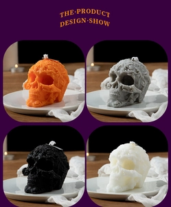 Detail showing skull-shaped scented candles in orange, grey, black, and white colors