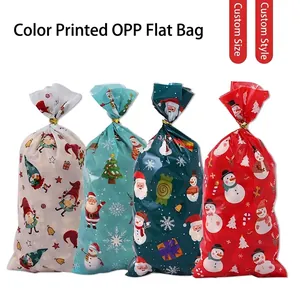 Christmas OPP gift bags with Santa and snowman prints featuring gold twist ties