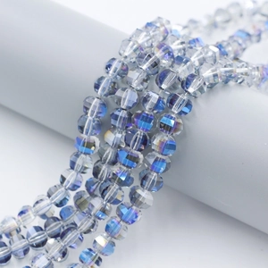 Detailed macro view of multifaceted aurora blue crystal beads for DIY jewelry making