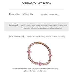 Macro detail of pink zircon flower bracelet with gold copper plating and adjustable chain