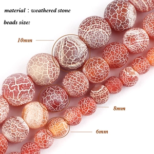 Macro view of 6mm, 8mm, and 10mm weathered stone beads with unique orange cracked texture
