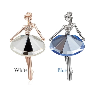 Detail view of ballet girl brooches with white and blue faceted crystal skirts