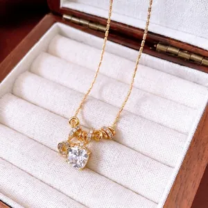 Exquisite 18k gold plated necklace with heart-shaped zircon pendant on a jewelry box