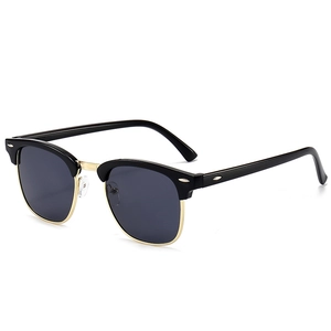Classic semi-rimless Clubmaster sunglasses with black frame and gold metal accents