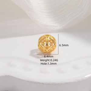 Macro detail of a 6.4mm golden hollow barrel bead with precise technical measurements