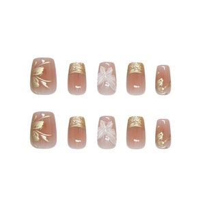 Unghie finte nude pink fatte a mano con foglia d'oro, fiori bianchi e punte glitterate