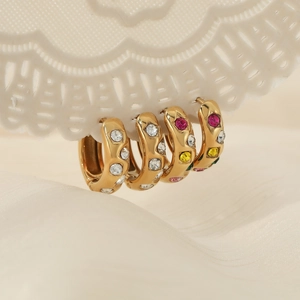 French vintage stainless steel gold hoops with multi-colored zircons on white silk background