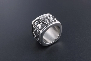 Detailed view of vintage silver gothic skull relief ring with cool metallic finish