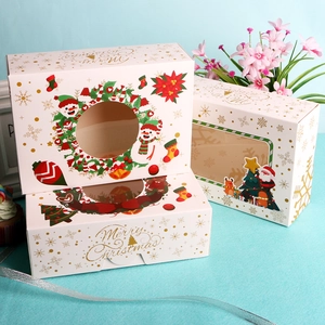 Christmas themed cupcake boxes with festive patterns and clear window display