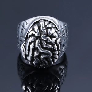 Detailed macro view of vintage silver brain ring with intricate anatomical textures