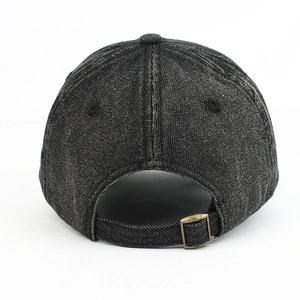 Detailed back view of washed denim baseball cap featuring an adjustable brass metal buckle