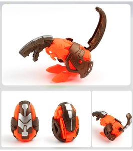 Close-up showing the transformation of an orange dinosaur toy from egg to robot figure