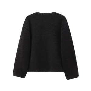 Back view of black teddy fleece jacket showing soft plush texture and minimalist design