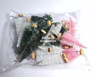 Mini sisal Christmas trees in assorted colors with snow effect and wooden base
