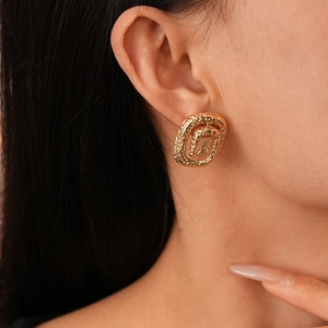Elegant gold-tone hammered metal earrings with irregular spiral square design for women