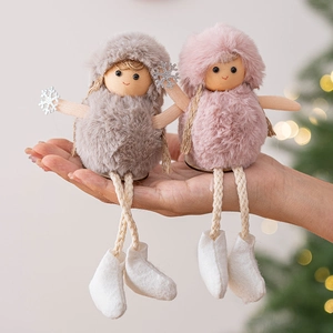 Christmas plush doll ornaments in grey and pink with snowflake details on a tree background