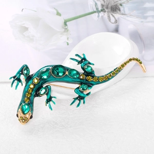 Broche lézard vintage en émail vert et cristaux sur une base en métal doré