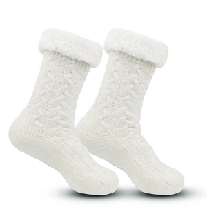 Detail of white knitted slipper socks with soft fleece trim and thick thermal lining