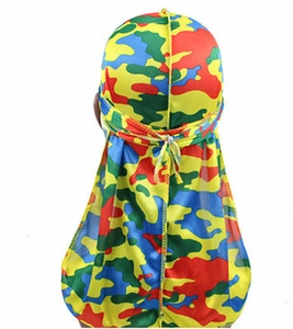 Detail showing the long tail strap and stitching of a colorful camo satin durag