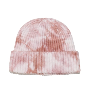 Detailed close-up of the ribbed knit texture and pink-white tie-dye pattern on the beanie