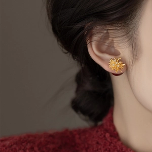 Elegant gold fireworks pearl stud earrings with zircon inlay shown on model ear