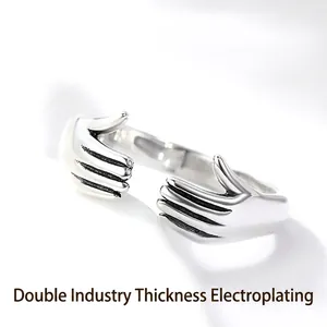 Polished silver hugging hands open ring with thick electroplating for couples