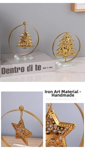 Detailed view of handmade golden iron Christmas tree and star with crystal base