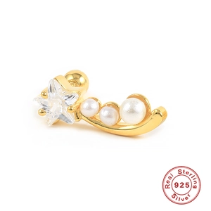 Detailed macro view of gold-plated S925 sterling silver ear stud with star zircon and pearls