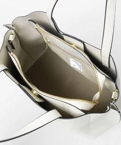 Top view of off-white PU tote bag showing interior compartments and magnetic closure