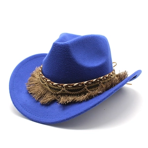 Close-up of electric blue felt cowboy hat with brown fringe and gold chain detail