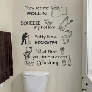 Funny bathroom wall decals with black PVC phrases like Potty like a Rockstar on white wall