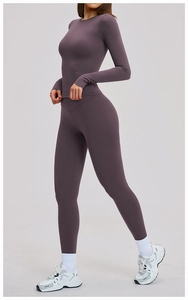 Side view of matte purple yoga set featuring long sleeve top and high waist leggings