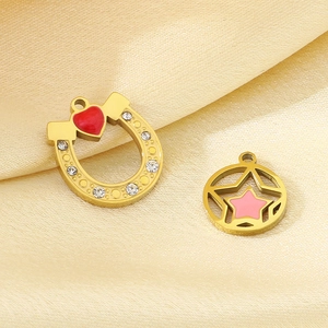 Golden stainless steel star and heart charms with rhinestones on silk fabric