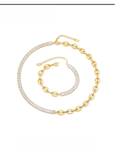 Detail of gold titanium necklace and bracelet set with cubic zirconia and mariner links