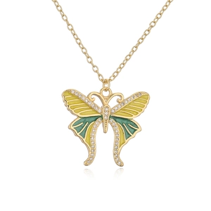 Detail of 18K gold plated butterfly necklace with yellow green enamel and crystals