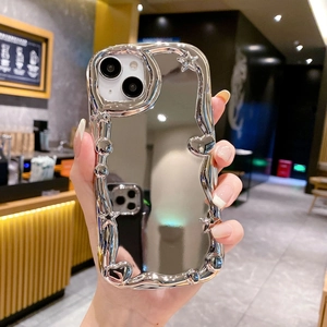 Detail of silver mirror phone case with wavy edges, 3D stars and hearts for iPhone