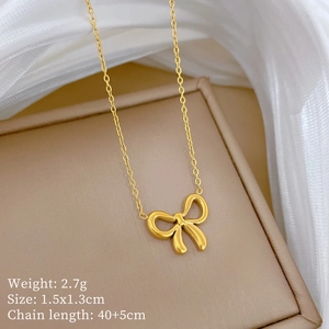 Detail of gold bow necklace showing dimensions 1.5x1.3cm and 40+5cm chain length