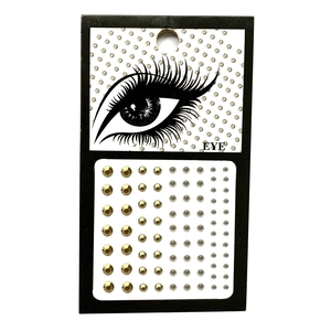 Detail of self-adhesive gold and silver rhinestone face gems for eye makeup in mixed sizes
