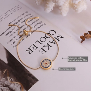 18K gold plated snake chain bracelet featuring white enamel daisy and adjustable slide clasp