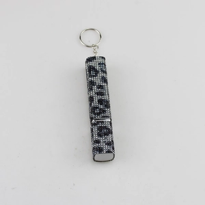 Leopard print rhinestone perfume spray bottle with metallic key ring and crystal finish