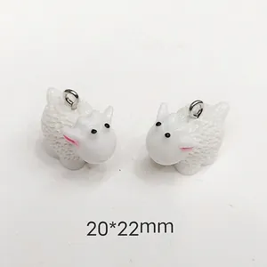 Macro view of 20x22mm white sheep charms with silver rings for DIY jewelry making