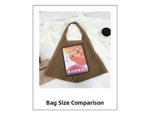 Brown canvas tote bag detail showing large capacity compared to a standard iPad tablet