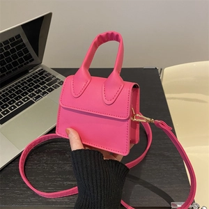 Mini rose red crossbody bag with golden metal hardware and top handle for women