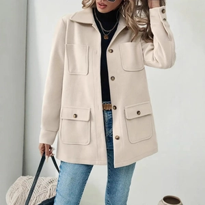 Detail of light beige wool jacket with four large pockets and button-up front closure